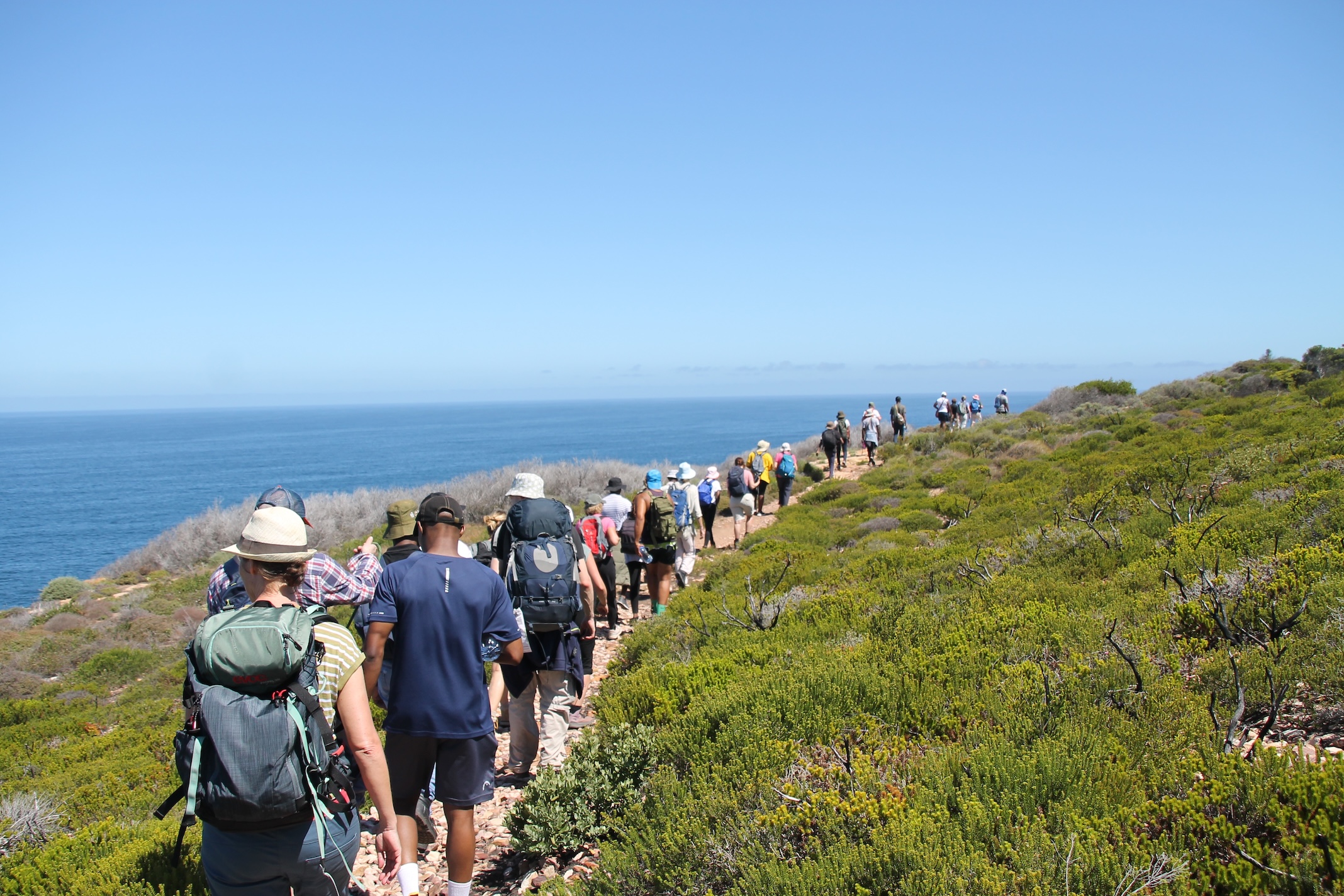 Community members walking along the coast, from the StreetBiz Foundation website